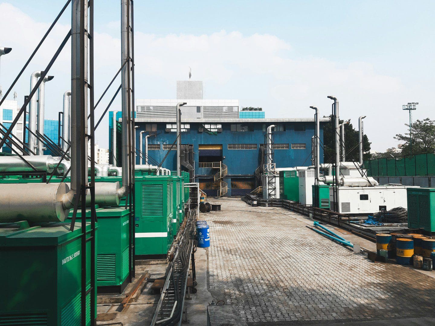 A dock with many green containers on it