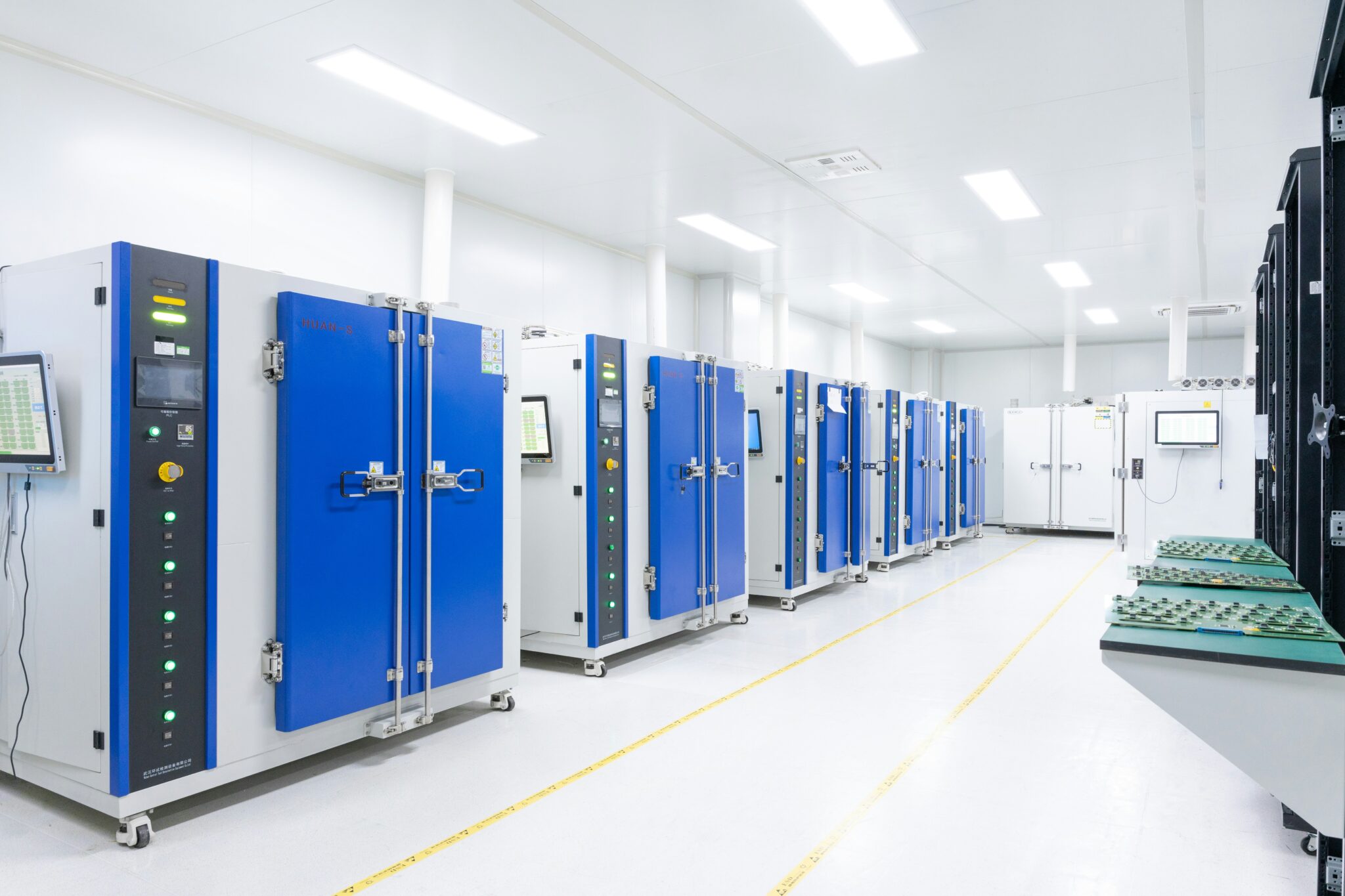 A row of blue doors in a room.