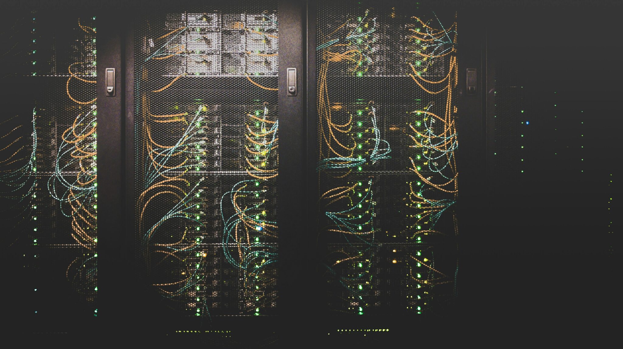 A bunch of wires are connected to the back of a cabinet