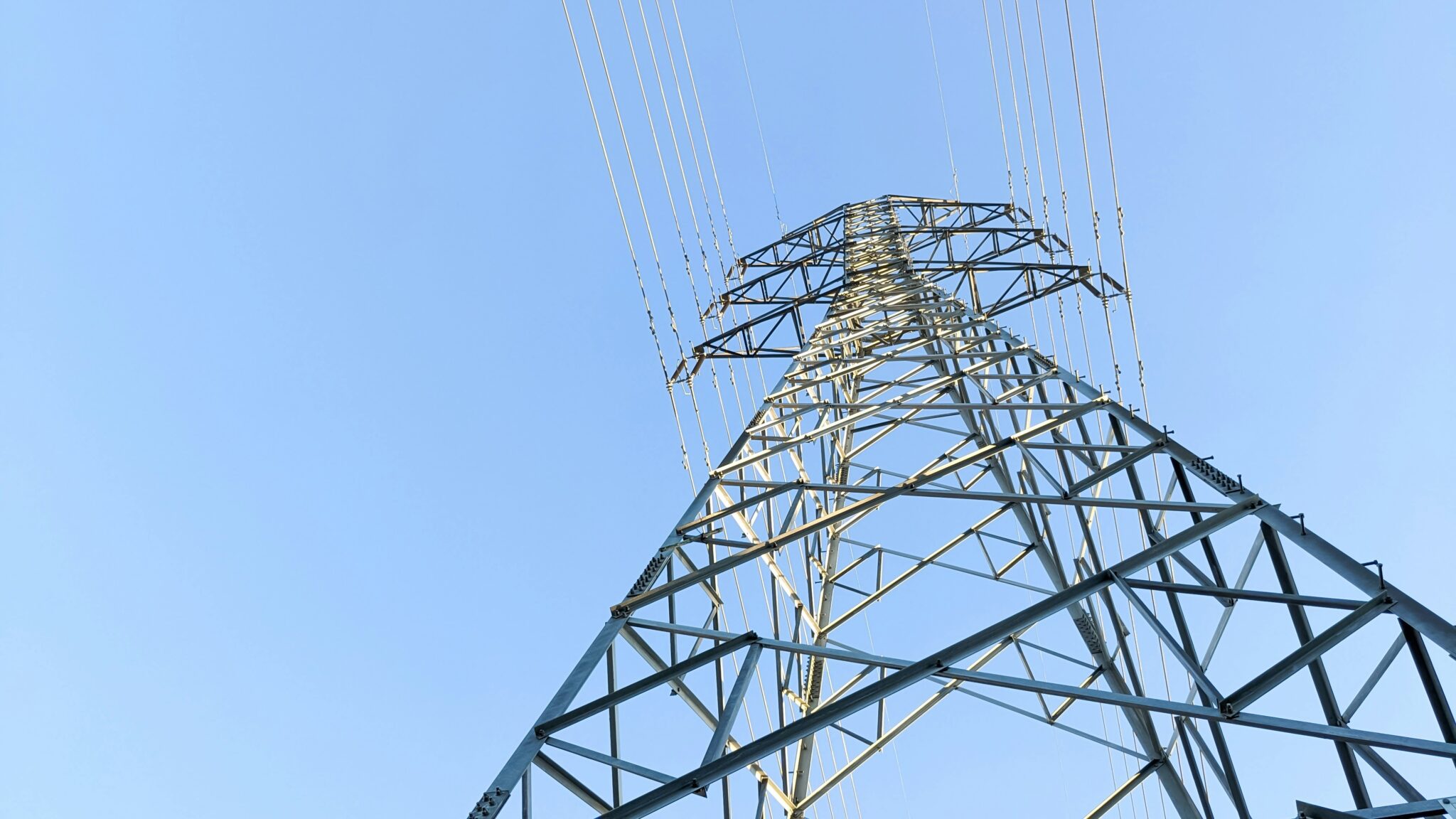 A power line tower with many wires on it