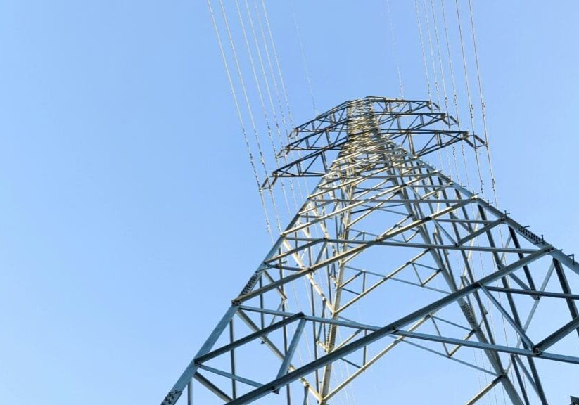 A power line tower with many wires on it
